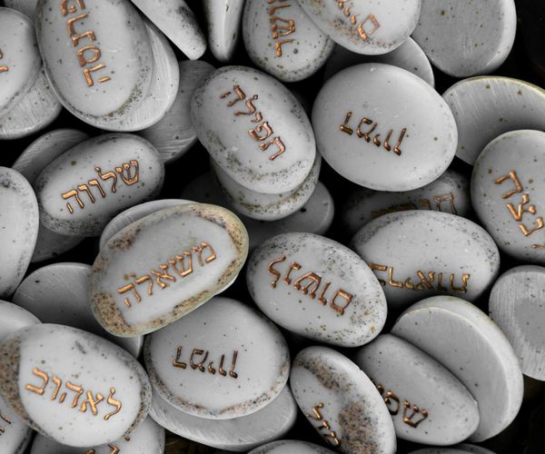 A collection of smooth stones stacked on top of each other, symbolizing balance.